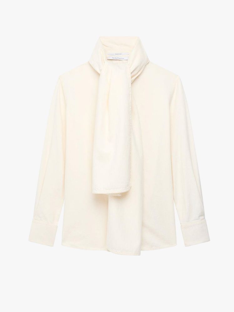 Image may contain Clothing Long Sleeve Sleeve Coat Jacket Blouse Shirt Knitwear Sweater and Blazer